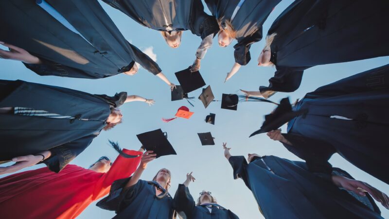 Graduates celebrating after graduating
