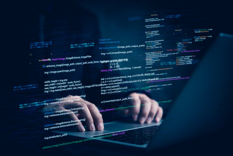 Person coding on a computer