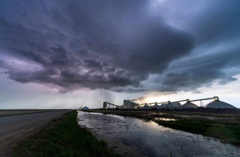 Storm clouds above a manufacturing/industrial facility