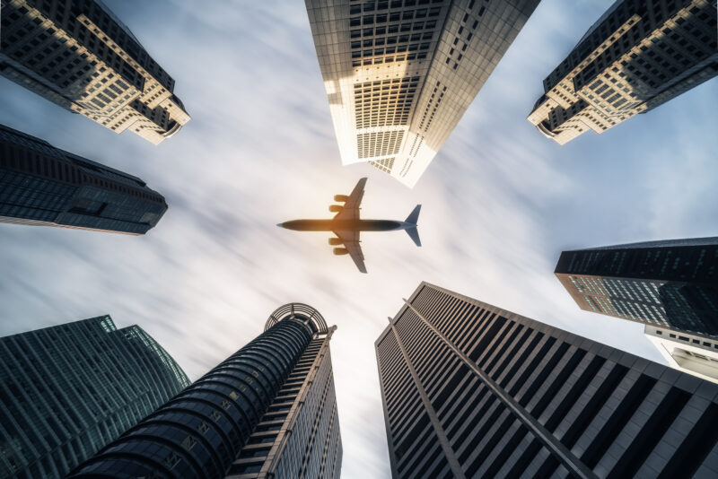 Plane flying over a city